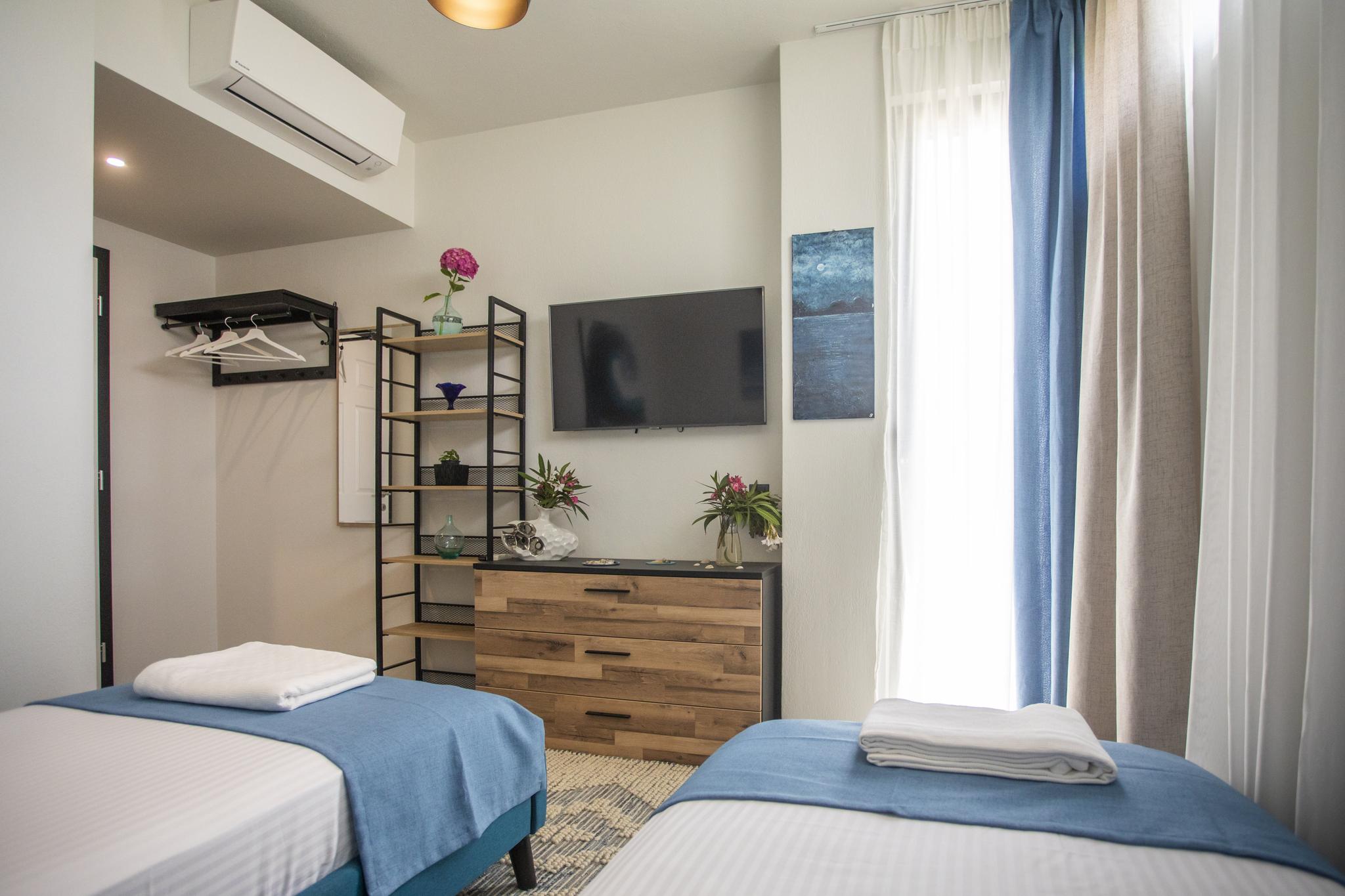 Peaceful private bedroom at Damari villa in Skiathos Greece — solo travel retreat in the pine forest hills